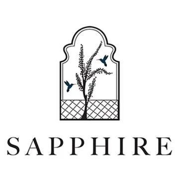 A display of a stylish Sapphire brand clothing collection from Pakistan, featuring elegant fabrics, intricate patterns, and vibrant colors